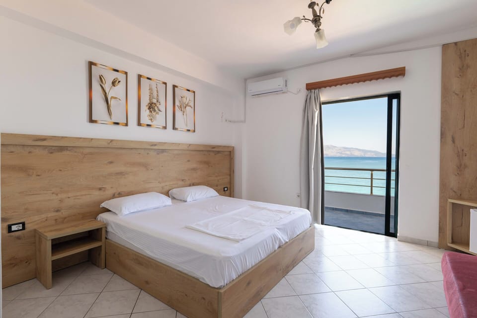 Standard Quadruple Room | Premium bedding, minibar, blackout drapes, iron/ironing board