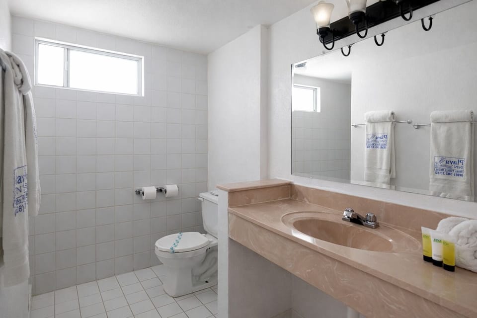 Deluxe Studio Suite, 2 Queen Beds | Bathroom | Shower, hair dryer (on request), towels, soap