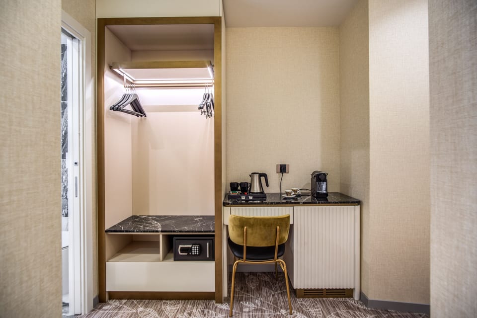 Premium Triple Room | Minibar, in-room safe, desk, blackout drapes