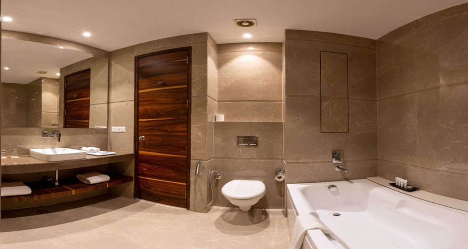 Executive Suite, 1 King Bed, Non Smoking, City View | Bathroom | Designer toiletries, hair dryer, slippers, bidet
