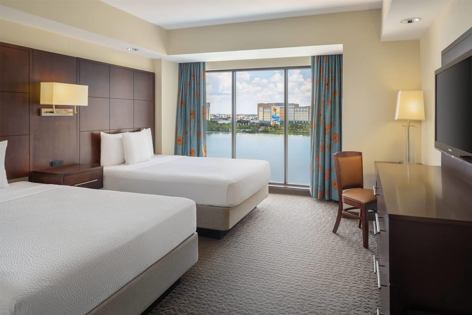 Premium bedding, laptop workspace, blackout drapes, soundproofing