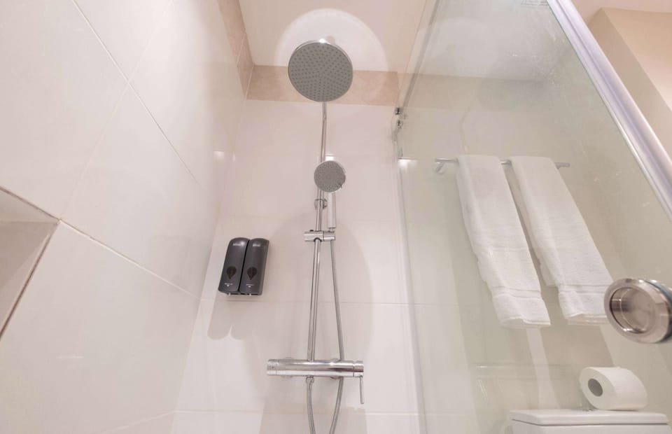 Shower, rainfall showerhead, towels, soap
