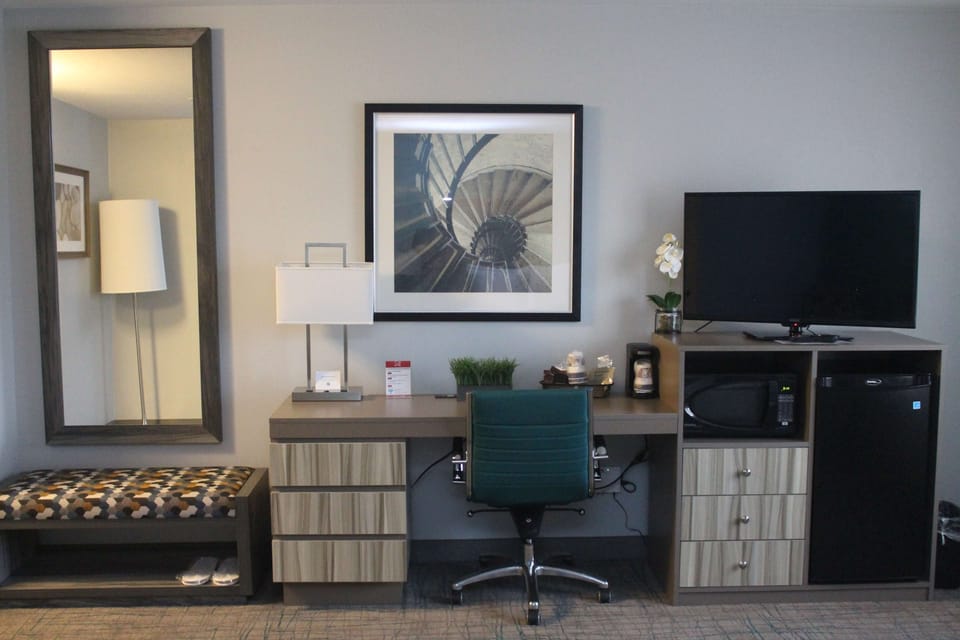 Desk, laptop workspace, iron/ironing board, free cribs/infant beds