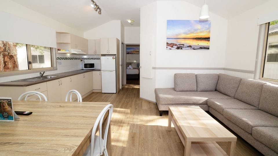 Water View Suite | Living area | 43-inch flat-screen TV with digital channels, TV