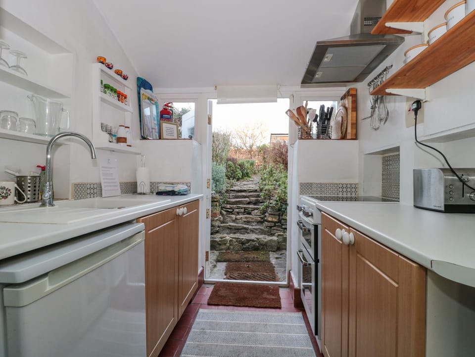 Fridge, electric kettle, toaster, cookware/dishes/utensils