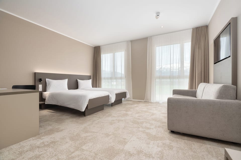 Junior Suite | Hypo-allergenic bedding, in-room safe, desk, blackout drapes