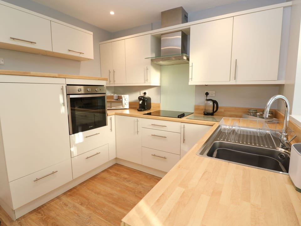 Fridge, electric kettle, toaster, cookware/dishes/utensils