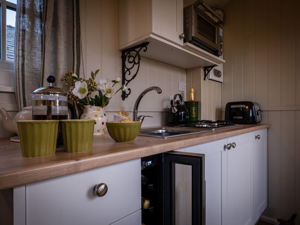 Fridge, electric kettle, cookware/dishes/utensils