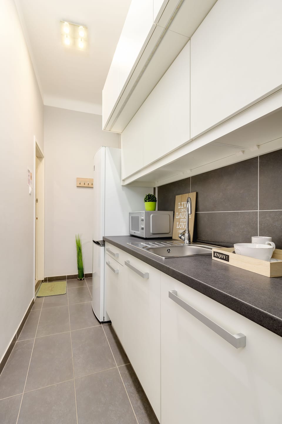 Comfort Apartment | Private kitchen | Full-size fridge, microwave, oven, stovetop