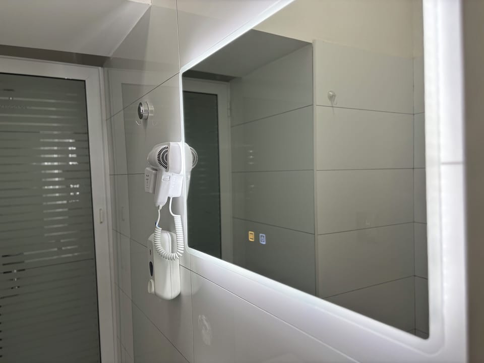 Comfort Room | Bathroom | Shower, rainfall showerhead, hair dryer, slippers