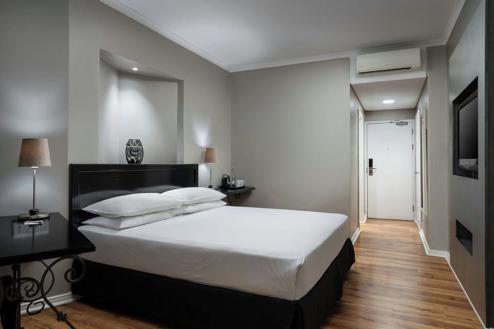 Room, 1 King Bed | In-room safe, desk, iron/ironing board (on request), cribs (free)