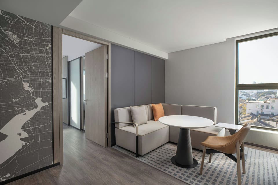 Basic Suite, 1 King Bed, City View | Living room | Flat-screen TV