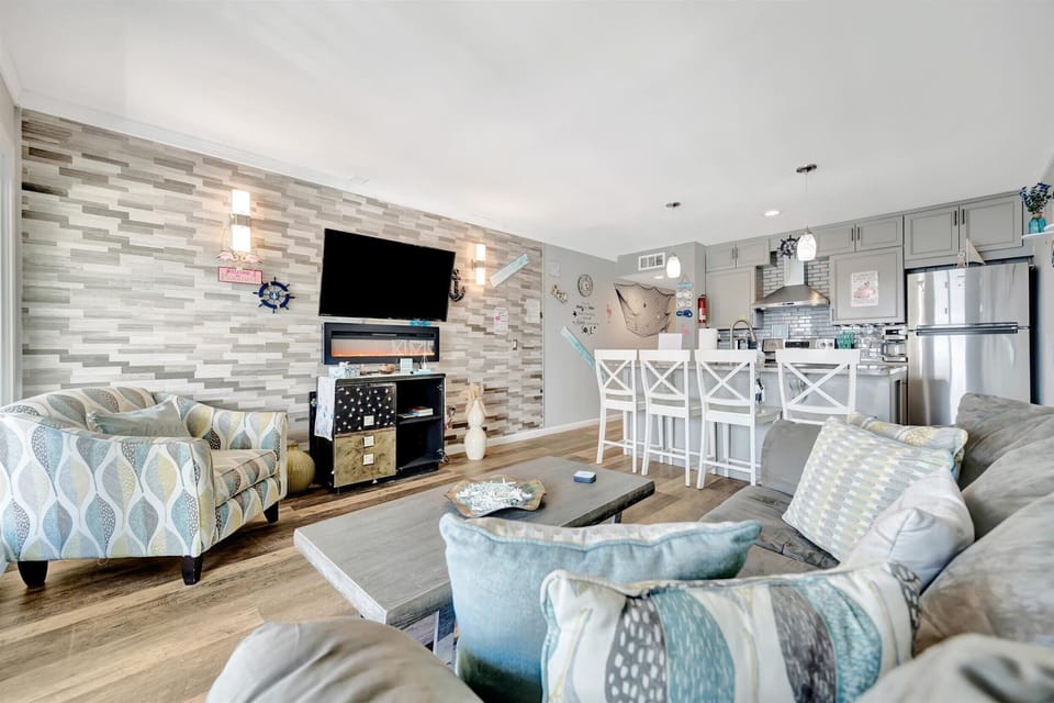 Panoramic Apartment, Fireplace, Bay View | Living area | 55-inch Smart TV with digital channels, TV