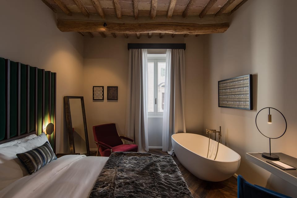 Deluxe Room | Minibar (free items), in-room safe, desk, blackout drapes