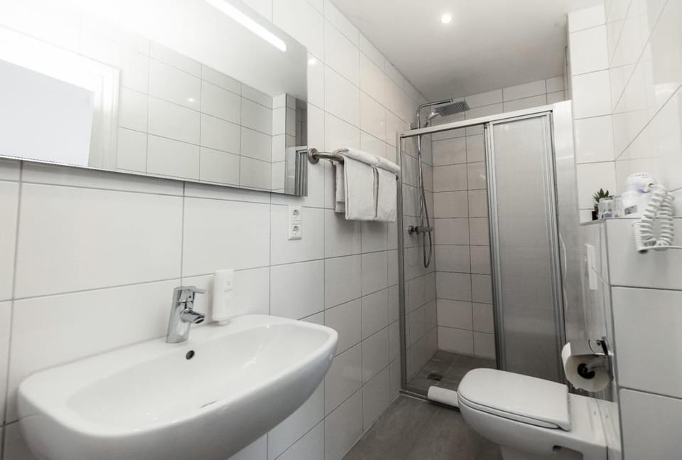 Shower, rainfall showerhead, hair dryer, towels