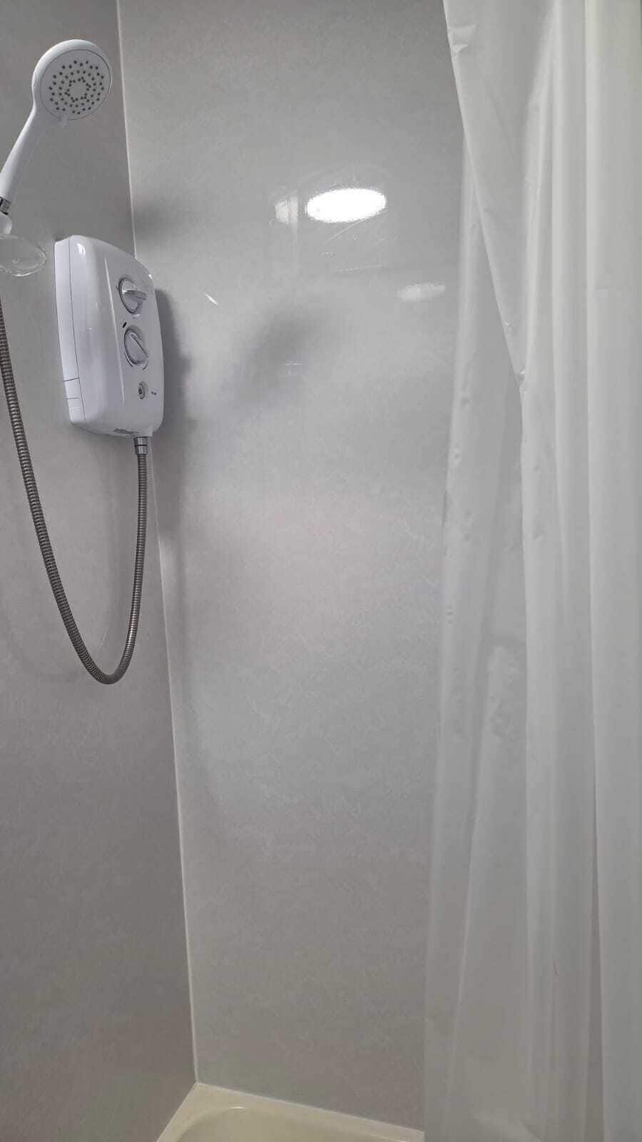 Family Quadruple Room, Multiple Beds | Bathroom | Combined shower/tub, free toiletries, hair dryer, towels