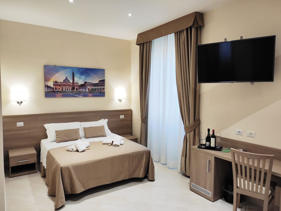 Family Quadruple Room | Minibar, in-room safe, individually decorated, individually furnished