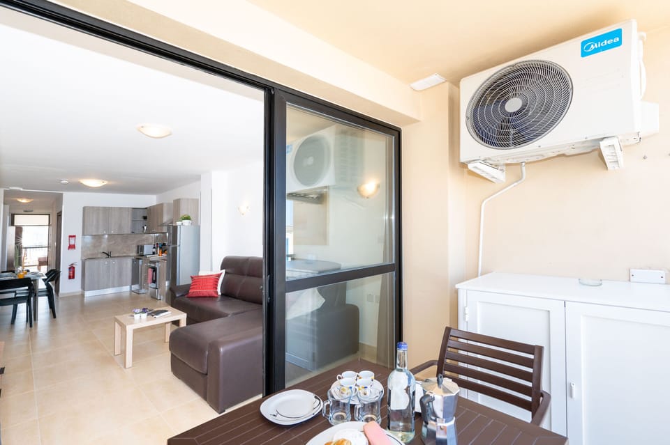 Standard Apartment, 1 Bedroom, Partial Ocean View | Living area | 43-inch LCD TV with satellite channels, TV