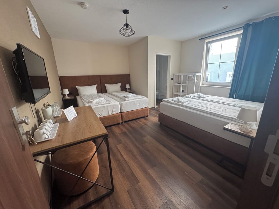 Quadruple Room, Ensuite | Down comforters, minibar, desk, free WiFi