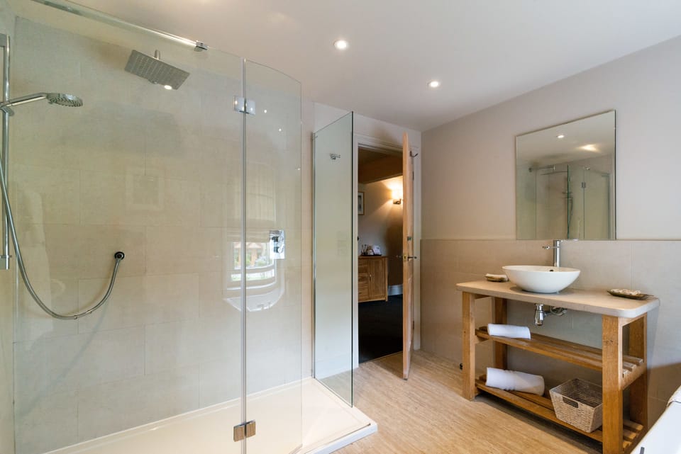 Family Room, Multiple Beds | Bathroom | Combined shower/tub, free toiletries, hair dryer, towels
