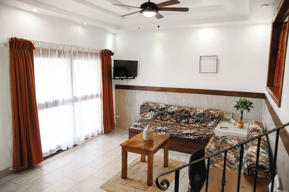 Family Room | In-room safe, desk, laptop workspace, blackout drapes