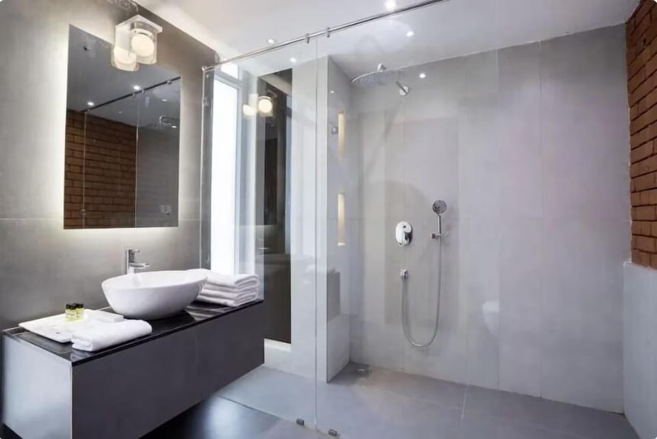 Pool view with Balcony | Bathroom | Shower, free toiletries, towels, soap