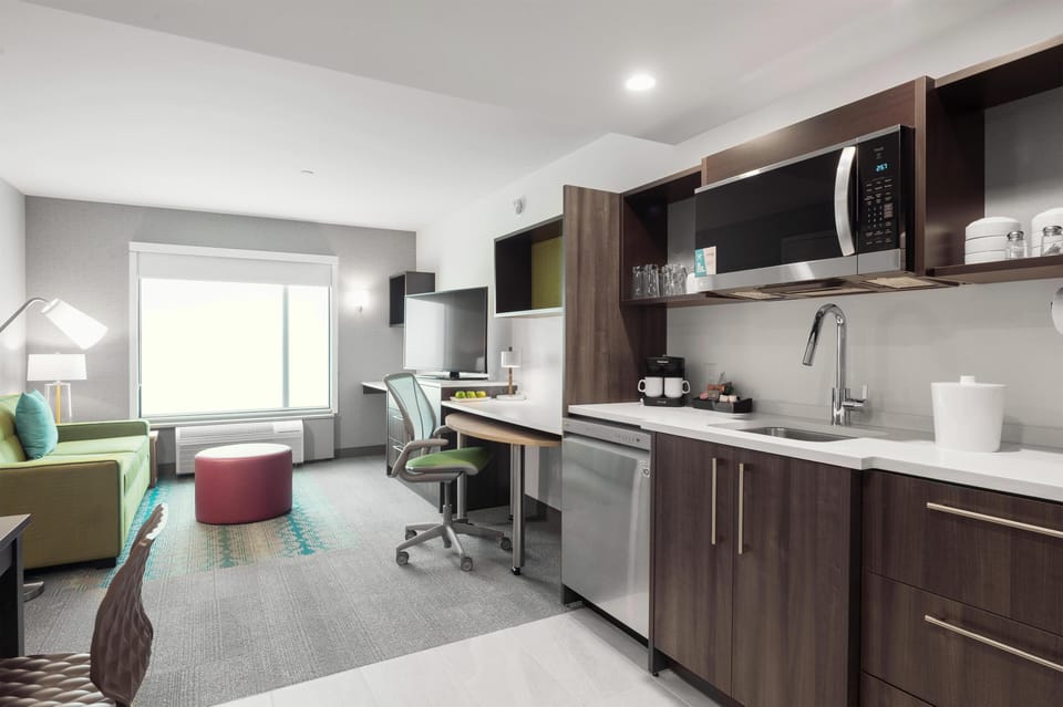 Suite, 1 Bedroom | Private kitchen | Full-size fridge, microwave, dishwasher, coffee/tea maker