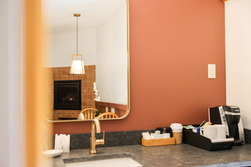 Signature Fireplace Suite | Premium bedding, desk, blackout drapes, iron/ironing board