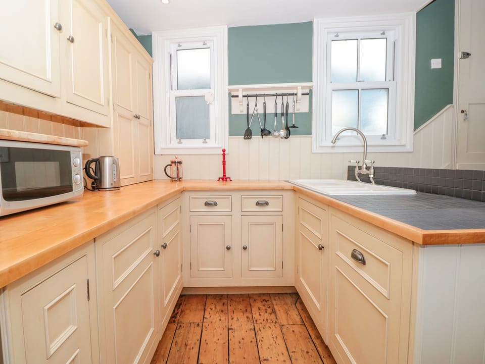 Fridge, electric kettle, toaster, cookware/dishes/utensils