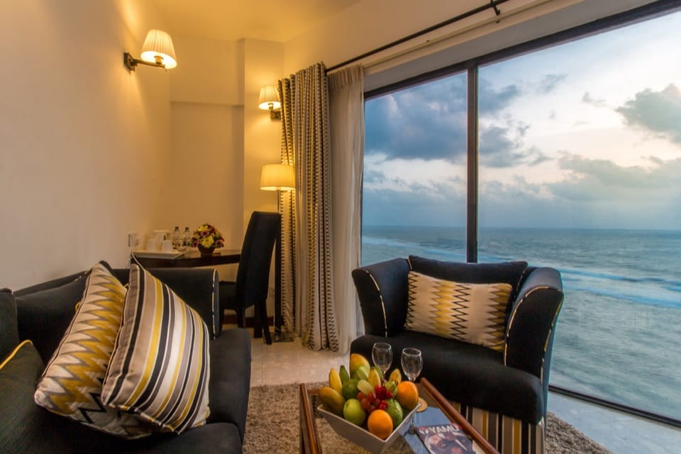Premier Suite with Ocean View | Living area | Flat-screen TV
