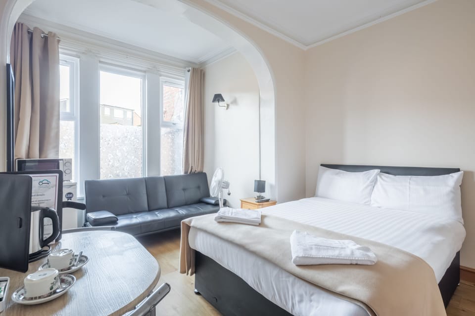 Classic Double Room | Desk, blackout drapes, iron/ironing board, free cribs/infant beds