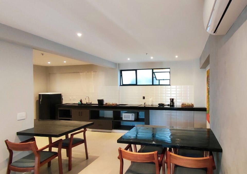 Premium Studio Suite | Private kitchen | Fridge, microwave, stovetop, dining tables