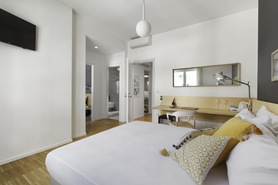 Family Quadruple Room, Multiple Beds, Non Smoking, City View | Premium bedding, down comforters, pillowtop beds, in-room safe