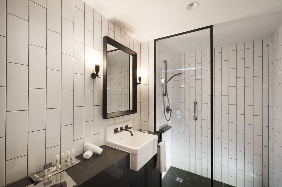 Shower, designer toiletries, hair dryer, bathrobes