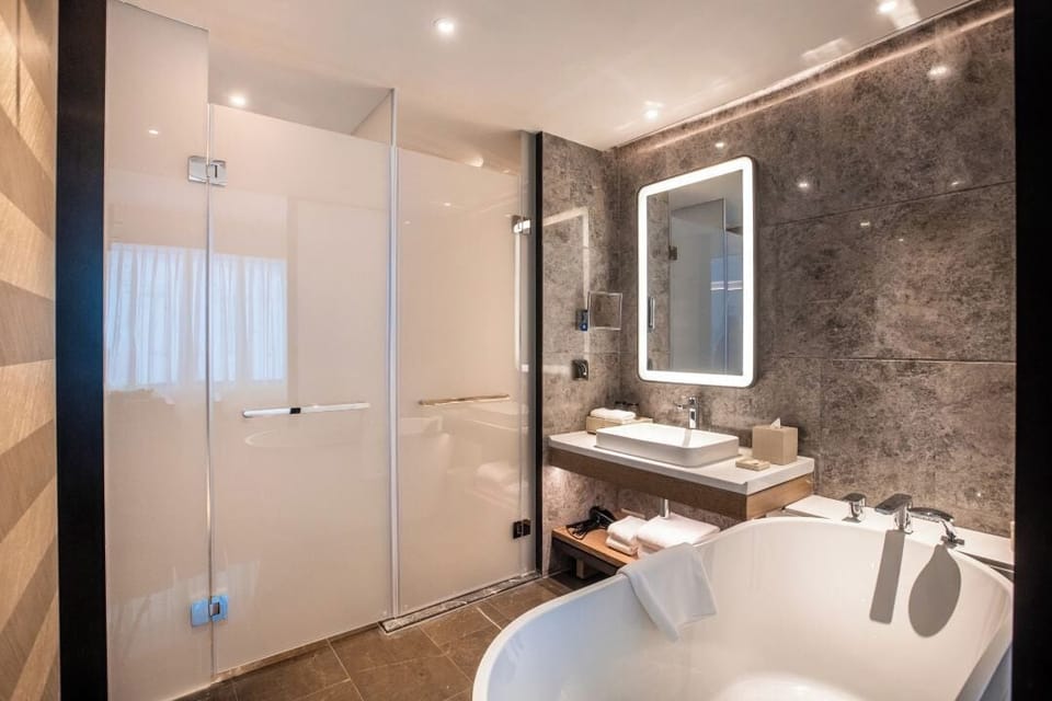 Family Room, 2 Double Beds, Mountain View | Bathroom | Hair dryer, bathrobes, slippers, towels