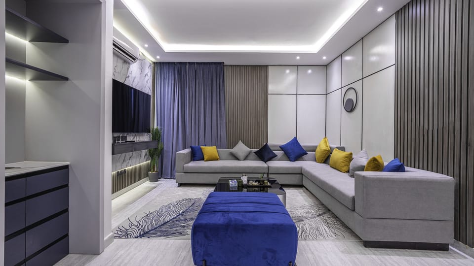 Apartment, 2 Bedrooms | Living area | 70-inch TV with digital channels