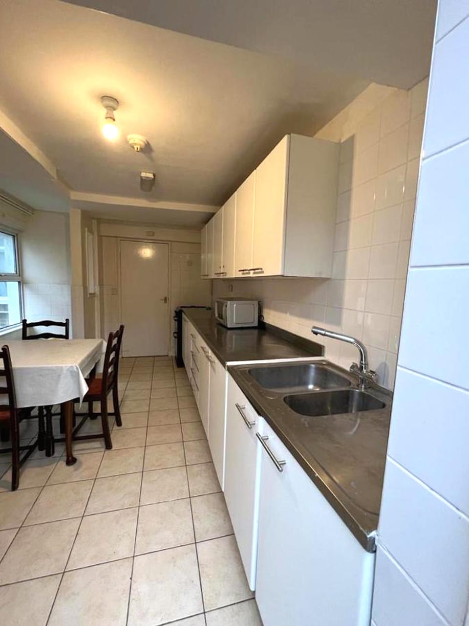 Full-size fridge, microwave, cookware/dishes/utensils
