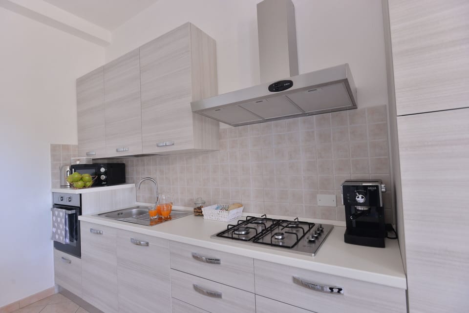 Apartment | Private kitchen | Full-size fridge, microwave, oven, espresso maker