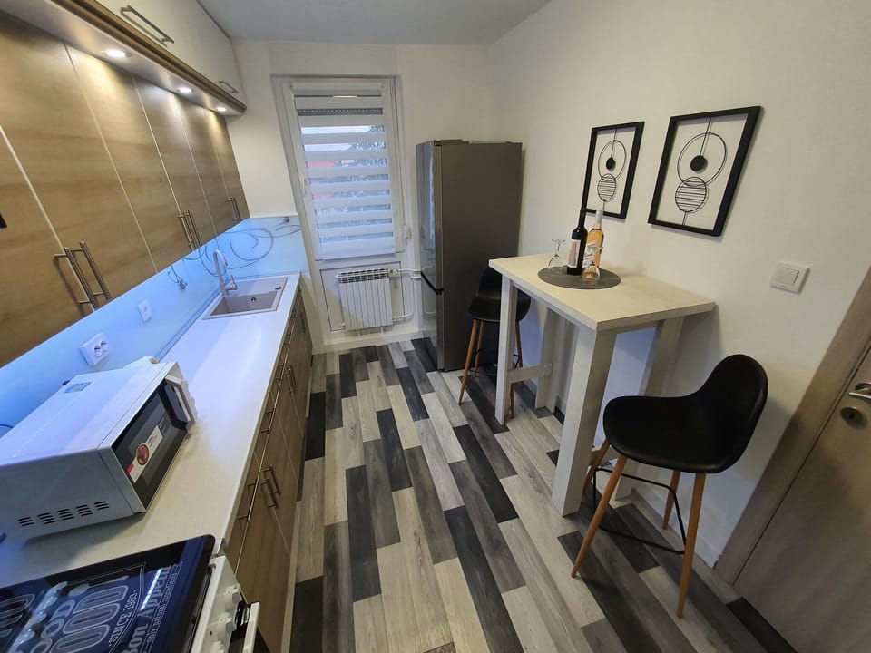 Apartment (One Bedroom Apartment with Balcony) | Private kitchen | Fridge