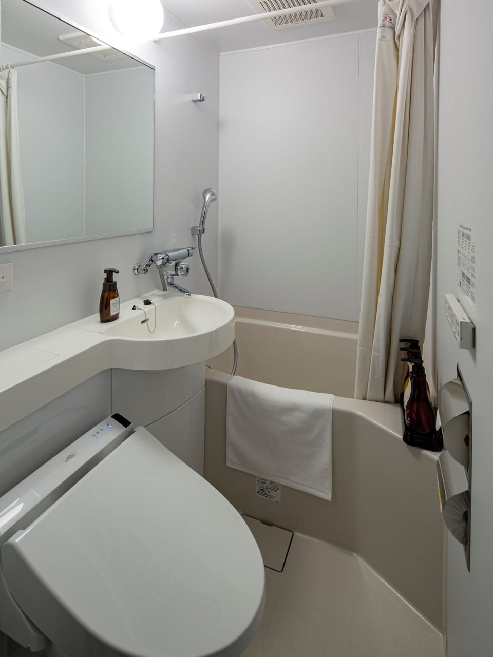 Combined shower/tub, free toiletries, hair dryer, slippers
