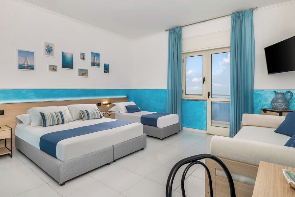 Junior Studio Suite, Sea View | Minibar, desk, laptop workspace, cribs/infant beds