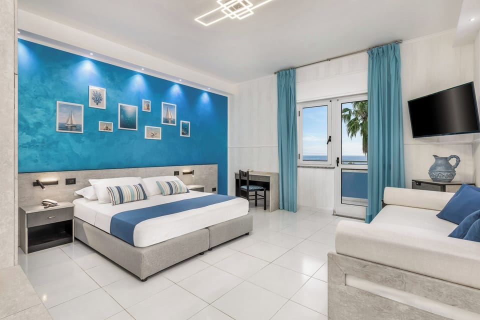 Junior Quadruple Room, Sea View | Minibar, desk, laptop workspace, cribs/infant beds