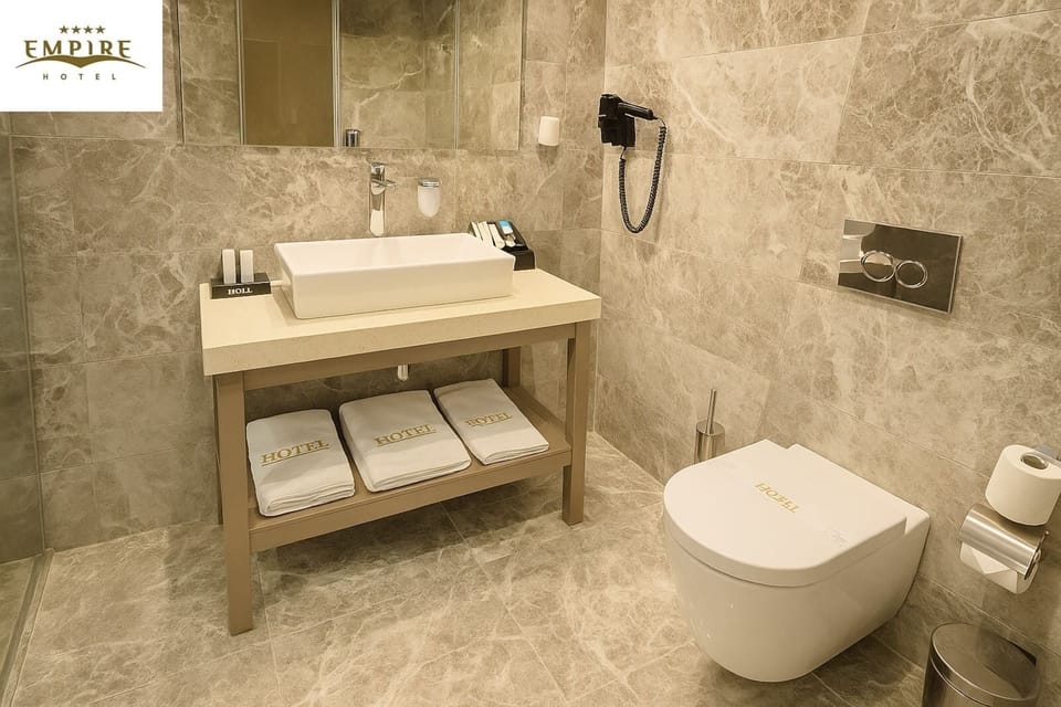 Standard Twin Room | Bathroom | Hair dryer, slippers, towels, soap