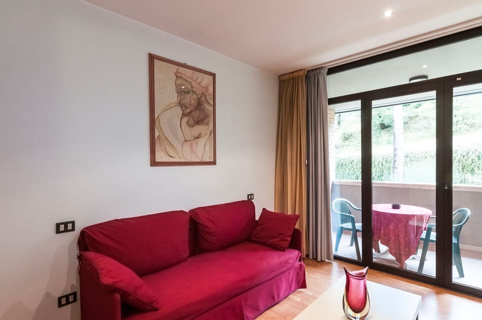 Family Quadruple Room, Private Bathroom | Living area | 19-inch LED TV with satellite channels, TV