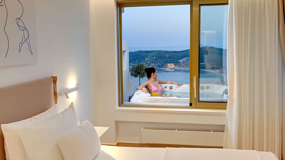 Superior Suite, Hot Tub, Sea View | Free minibar, in-room safe, laptop workspace, blackout drapes