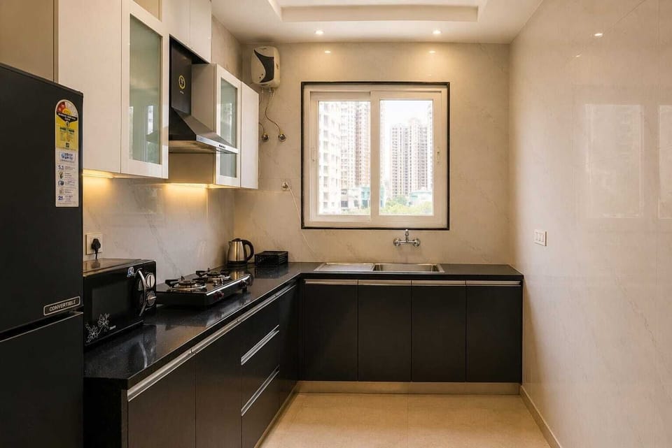 Comfort Apartment | Private kitchen | Fridge, microwave, cookware/dishes/utensils, freezer