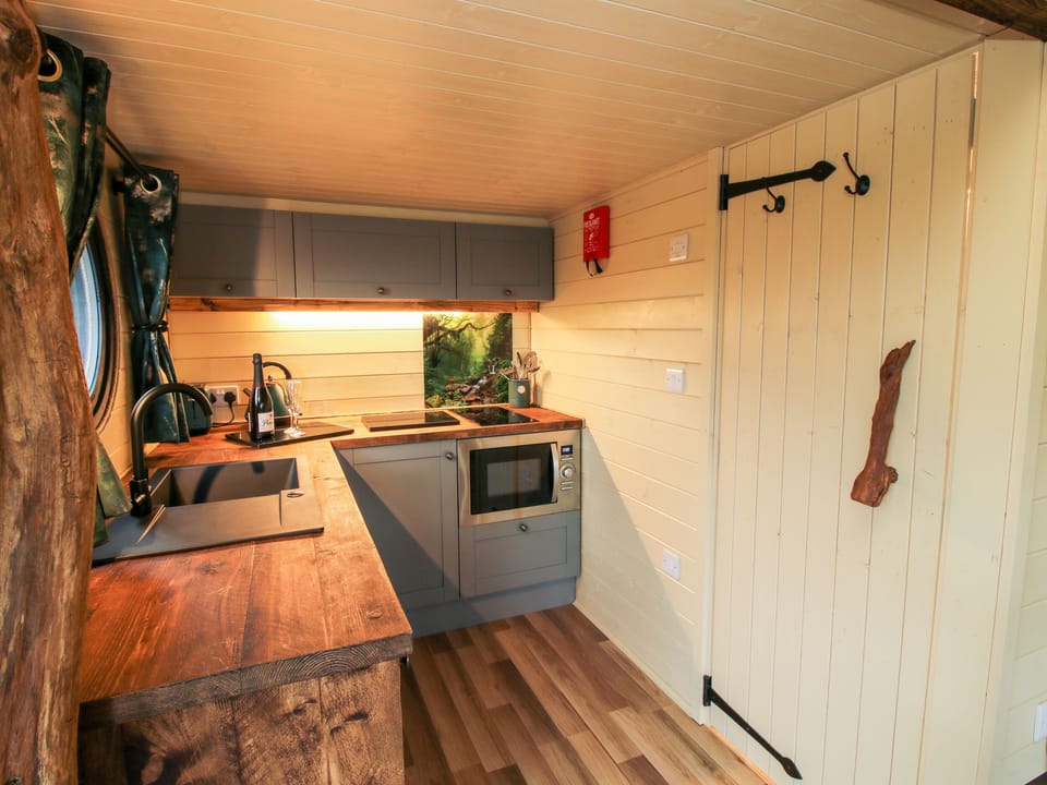 Fridge, electric kettle, cookware/dishes/utensils