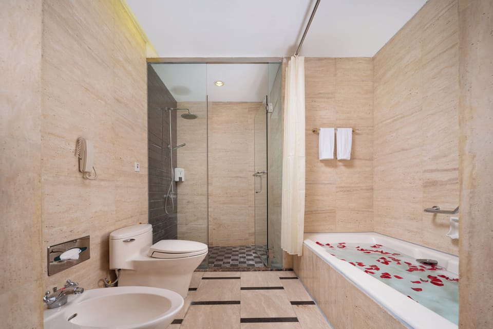 Business Studio Suite | Bathroom | Separate tub and shower, hair dryer, bathrobes, slippers