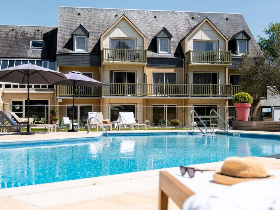 Outdoor pool, open 9:00 AM to 9:00 PM, pool umbrellas, sun loungers