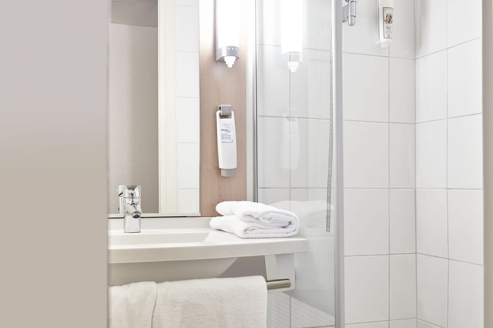 Shower, eco-friendly toiletries, hair dryer, towels